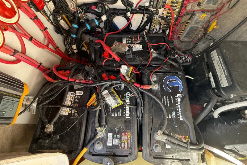 Slide: The Image of Battery compartment of a 1989 Wellcraft 302 Scarab with wiring and connections. - 109