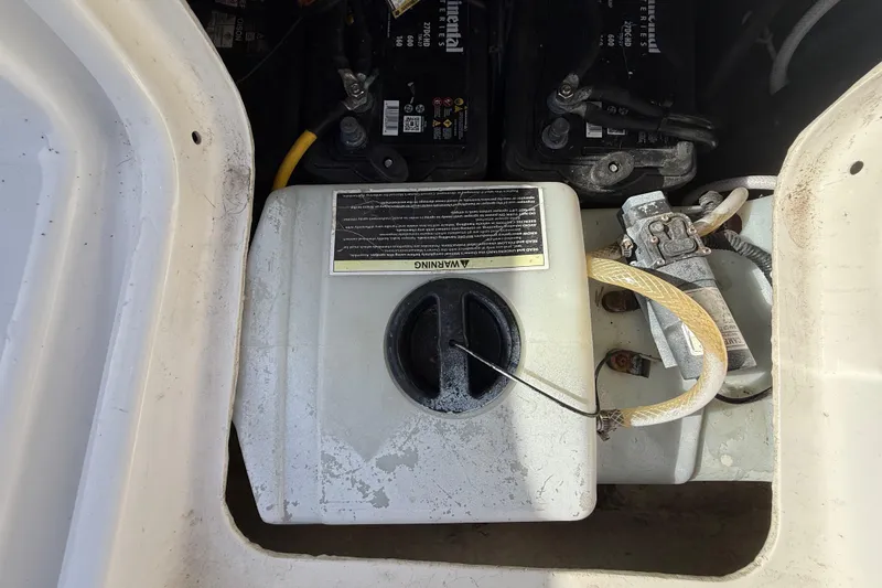 Slide: The Image of Battery compartment of a 1989 Wellcraft 302 Scarab boat, showing wiring and connections. - 110