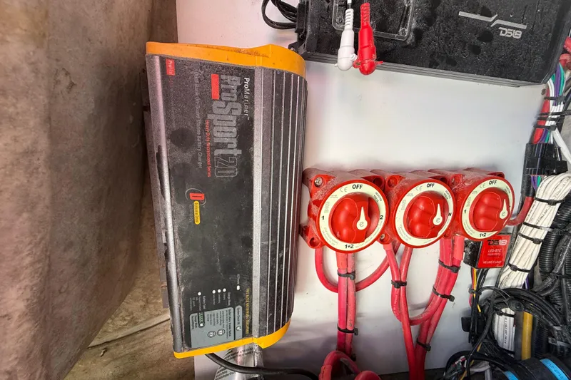 Slide: The Image of Battery charger and switches in a 1989 Wellcraft 302 Scarab boat. - 111