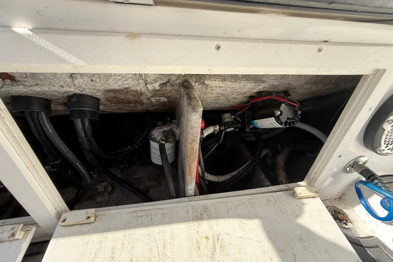 Slide: The Image of 1989 Wellcraft 302 Scarab engine compartment with visible wiring and components. - 113