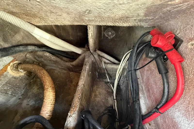 Slide: The Image of Wiring and hoses inside a 1989 Wellcraft 302 Scarab boat. - 117