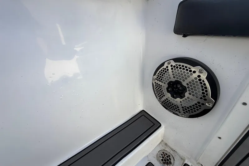 Slide: The Image of 1989 Wellcraft 302 Scarab boat interior with speaker and drain detail. - 119