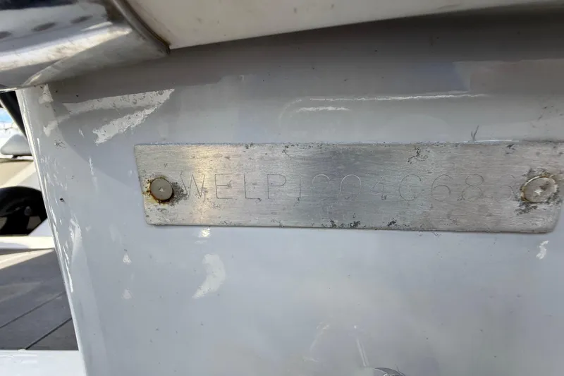Slide: The Image of 1989 Wellcraft 302 Scarab boat identification plate with engraved serial number. - 122