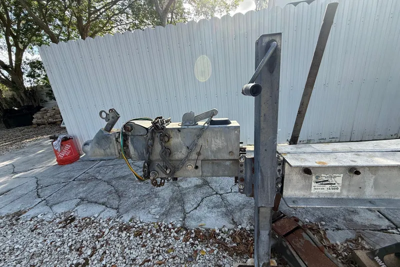 Slide: The Image of Trailer hitch for 1989 Wellcraft 302 Scarab boat, parked on gravel driveway. - 29