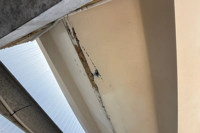 Slide: The Image of Cracked ceiling detail on 1989 Wellcraft 302 Scarab boat, showing structural wear. - 48