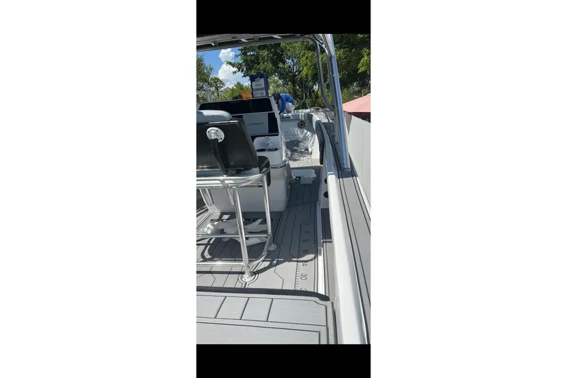 Slide: The Image of Twin propellers of a 1989 Wellcraft 302 Scarab boat on a concrete surface. - 5