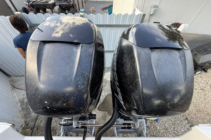 Slide: The Image of Twin Mercury outboard engines on a 1989 Wellcraft 302 Scarab boat, viewed from above. - 50