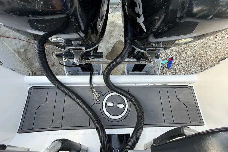 Slide: The Image of 1989 Wellcraft 302 Scarab boat with dual Mercury outboard engines, rear deck view. - 51