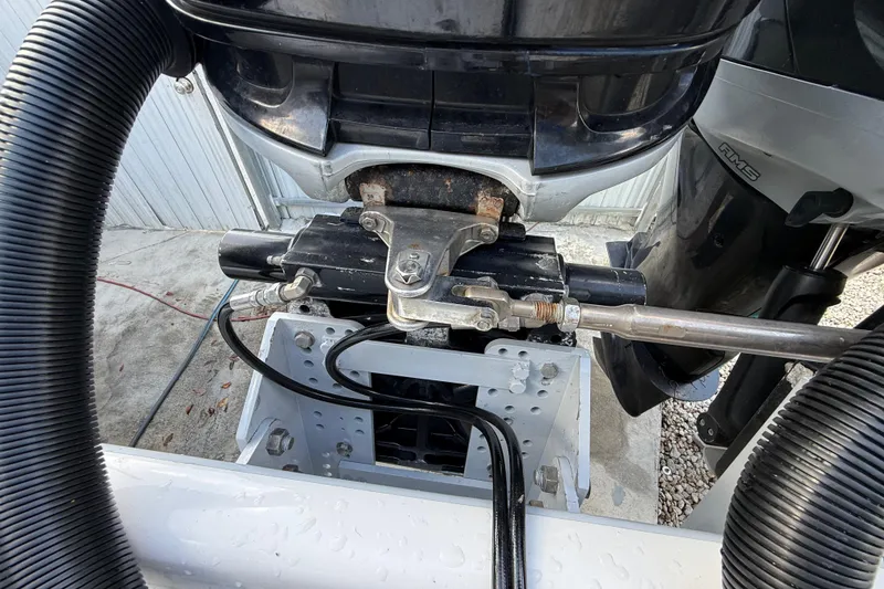 Slide: The Image of 1989 Wellcraft 302 Scarab engine close-up, showcasing mechanical components and hydraulic connections. - 52