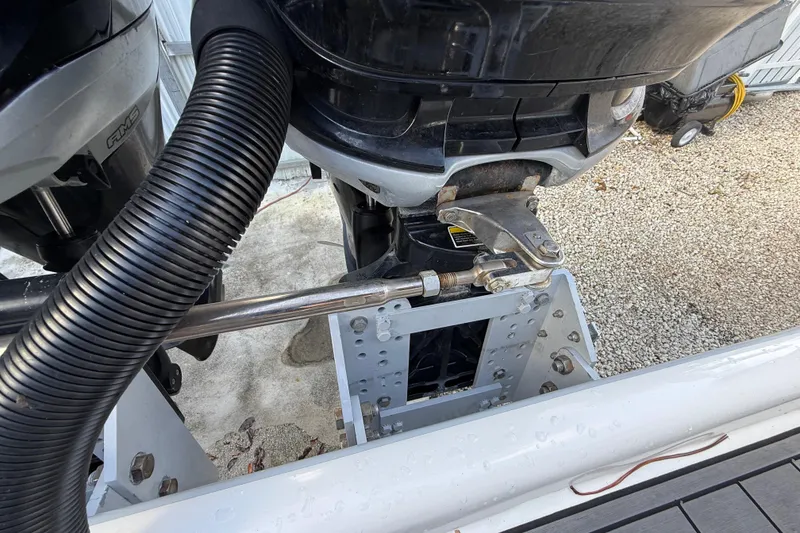 Slide: The Image of 1989 Wellcraft 302 Scarab boat engine detail with hydraulic steering and mounting components. - 53