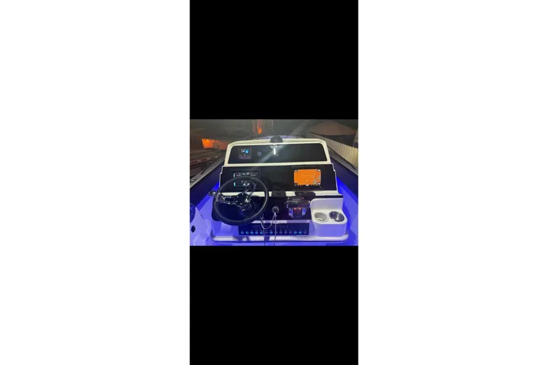 Slide: The Image of Twin 300 Verado outboard engines on a 1989 Wellcraft 302 Scarab boat. - 6