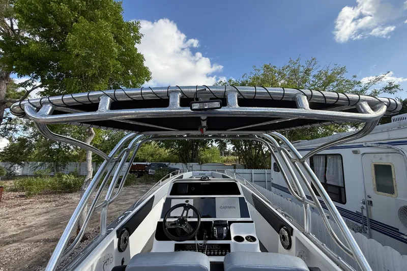 Slide: The Image of 1989 Wellcraft 302 Scarab boat with T-top and Garmin navigation system. - 65