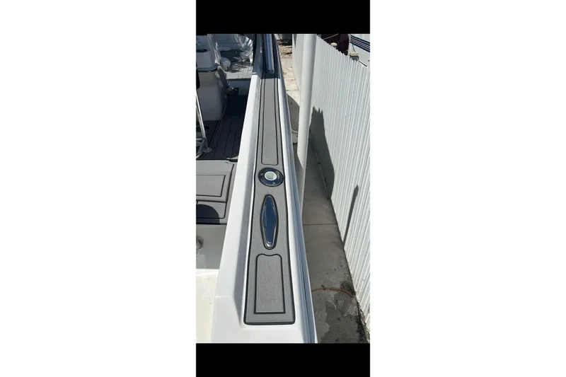 Slide: The Image of Twin Verado 300 outboard engines on a 1989 Wellcraft 302 Scarab boat. - 7