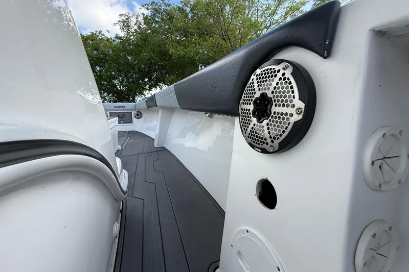 Slide: The Image of 1989 Wellcraft 302 Scarab boat interior with speaker, sleek design, and modern features. - 70