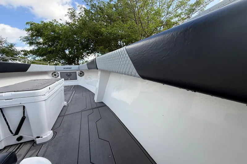 Slide: The Image of 1989 Wellcraft 302 Scarab boat interior with cushioned seating and sleek design. - 71