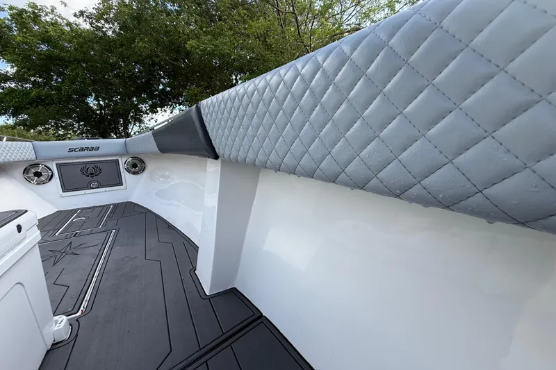 Slide: The Image of 1989 Wellcraft 302 Scarab boat interior with quilted upholstery and sleek design. - 72