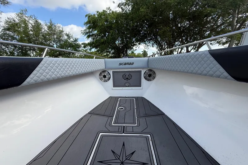 Slide: The Image of 1989 Wellcraft 302 Scarab boat interior with quilted upholstery and sleek deck design. - 74