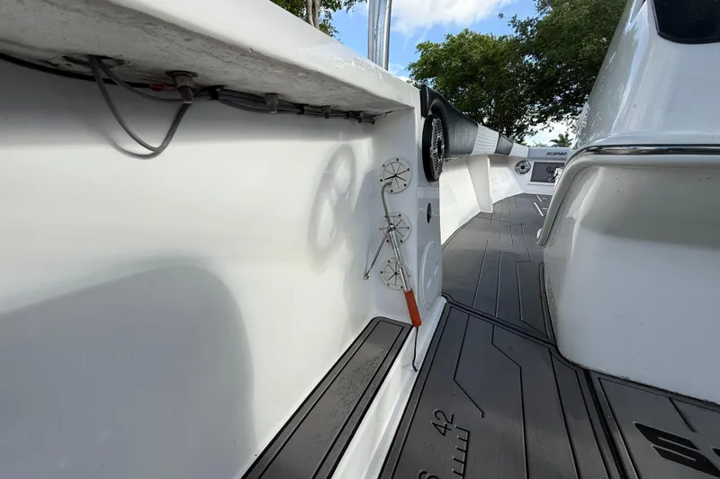 Slide: The Image of 1989 Wellcraft 302 Scarab boat interior with sleek white design and modern fittings. - 76