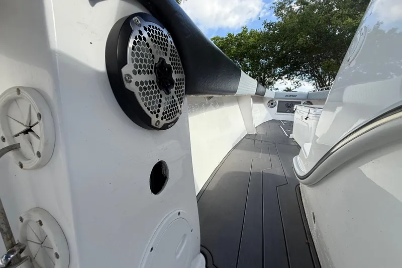 Slide: The Image of 1989 Wellcraft 302 Scarab boat interior with speaker and sleek design elements. - 77