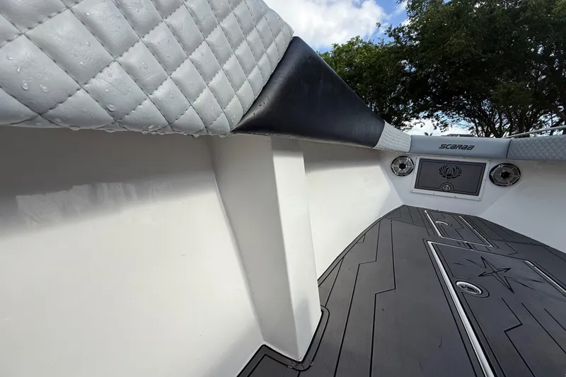 Slide: The Image of Interior view of 1989 Wellcraft 302 Scarab boat with quilted upholstery and sleek flooring. - 79