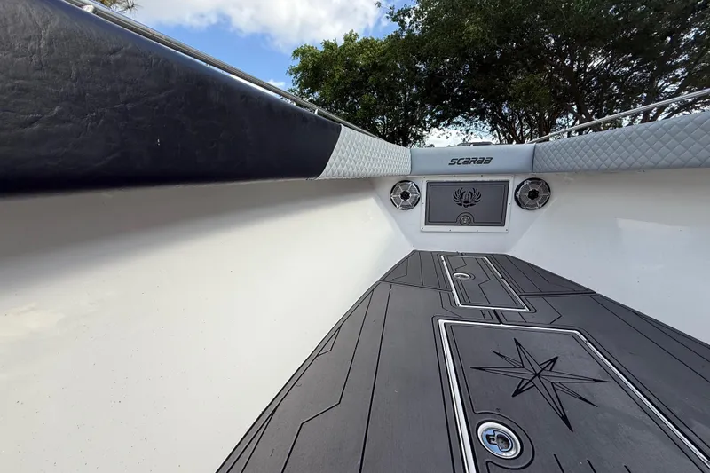 Slide: The Image of 1989 Wellcraft 302 Scarab boat interior with custom flooring and speaker system. - 80