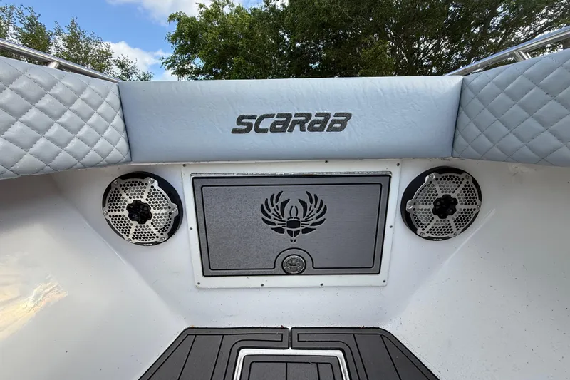 Slide: The Image of 1989 Wellcraft 302 Scarab boat interior with speakers and logo detail. - 81