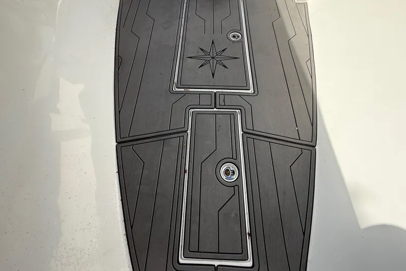 Slide: The Image of 1989 Wellcraft 302 Scarab boat deck with star design and textured surface. - 85