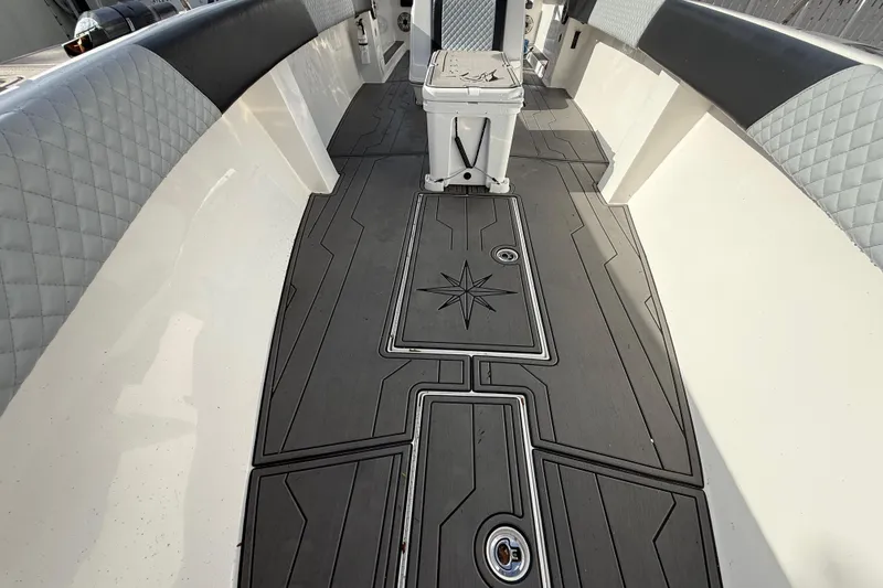 Slide: The Image of 1989 Wellcraft 302 Scarab interior with custom flooring and quilted upholstery. - 86