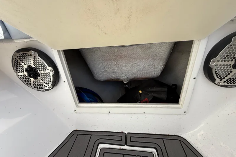 Slide: The Image of Storage compartment on a 1989 Wellcraft 302 Scarab boat with speakers visible. - 91
