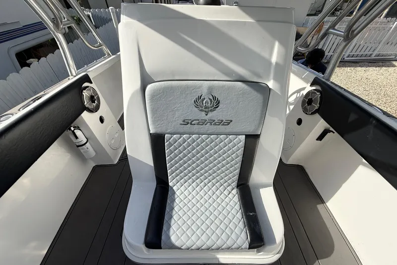 Slide: The Image of 1989 Wellcraft 302 Scarab boat seat with embroidered logo and quilted design. - 92