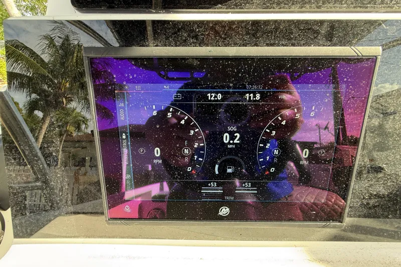 Slide: The Image of Dashboard of a 1989 Wellcraft 302 Scarab boat with digital gauges and reflections. - 96