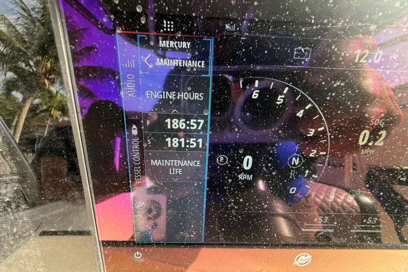 Slide: The Image of Dashboard of a 1989 Wellcraft 302 Scarab showing engine hours and maintenance details. - 98