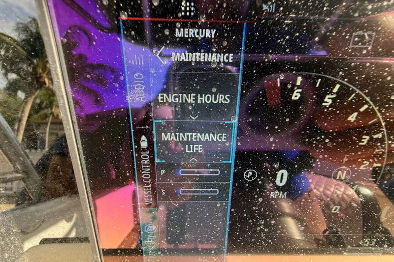 Slide: The Image of Dashboard of a 1989 Wellcraft 302 Scarab showing maintenance and engine hours. - 99