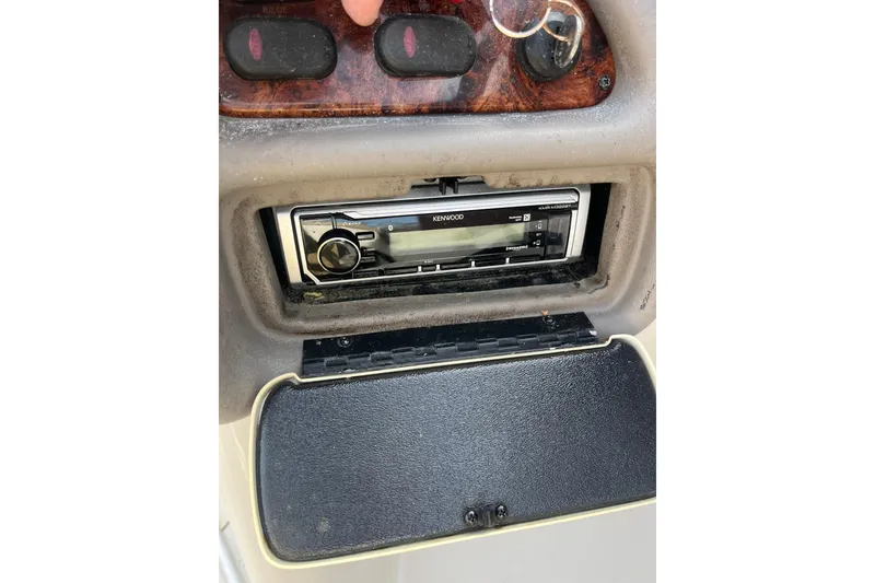 Slide: The Image of 2006 Tahoe 222 dashboard with Kenwood stereo system. - 16
