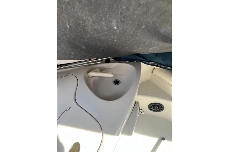 Slide: The Image of 2006 Tahoe 222 boat interior with sink and speaker detail. - 24