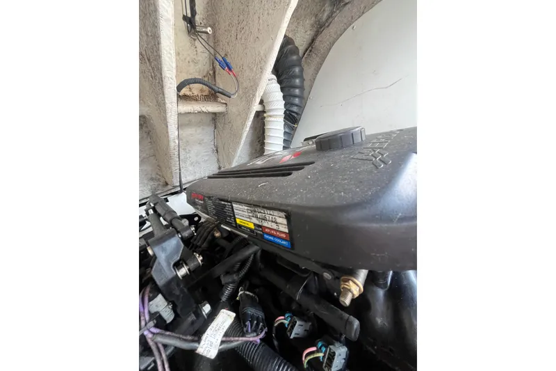 Slide: The Image of Engine compartment of a 2006 Tahoe 222 boat, showcasing detailed components and wiring. - 27