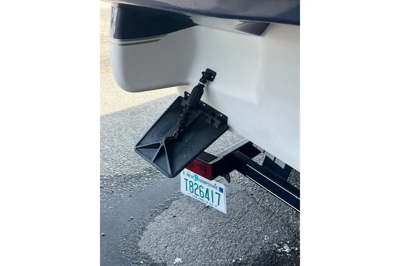 Slide: The Image of Rear view of a 2006 Tahoe 222 boat with a New Hampshire license plate. - 28