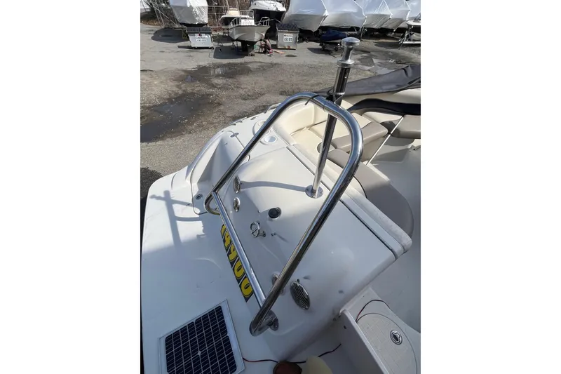 Slide: The Image of 2006 Tahoe 222 boat interior with stainless steel railings and seating area. - 8