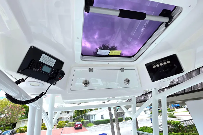 Slide: The Image of 2023 Sea Fox 288 Commander boat interior with control panel and skylight view. - 13