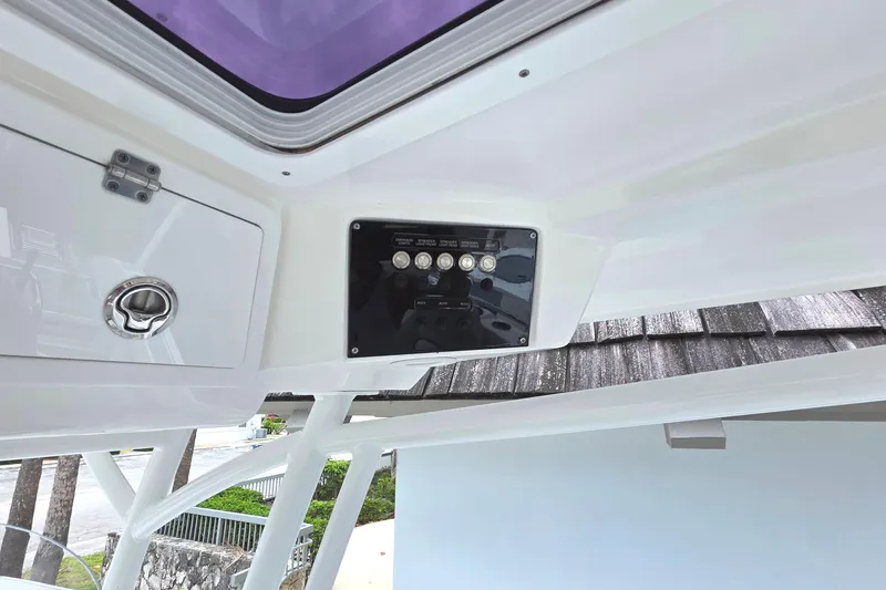 Slide: The Image of 2023 Sea Fox 288 Commander boat console with control panel and storage compartment. - 14