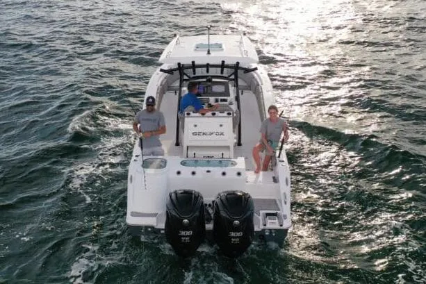 Slide: The Image of 2023 Sea Fox 288 Commander boat dashboard with dual Garmin displays and steering wheel. - 2