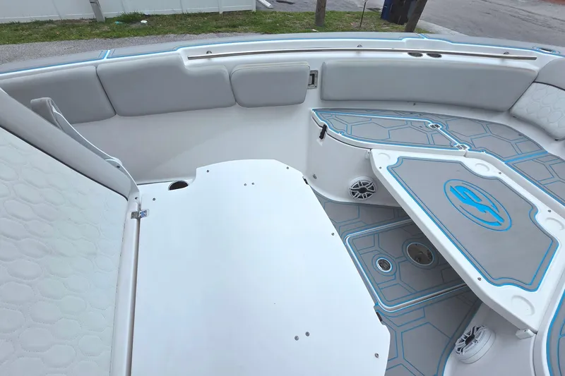 Slide: The Image of 2023 Sea Fox 288 Commander boat interior with cushioned seating and storage compartments. - 21