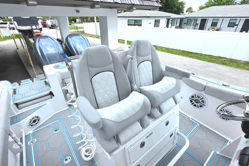Slide: The Image of 2023 Sea Fox 288 Commander boat interior with dual captain's chairs and modern design. - 23