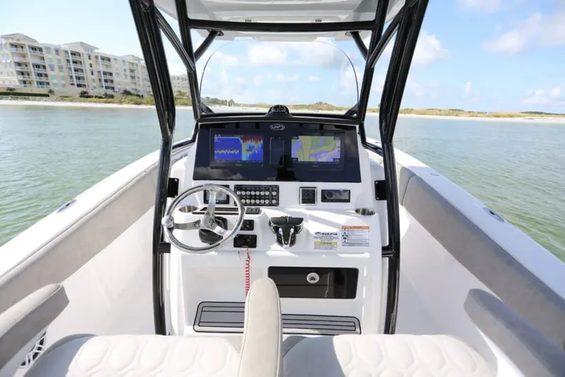 Slide: The Image of 2023 Sea Fox 288 Commander boat interior with cushioned seating and modern design. - 6