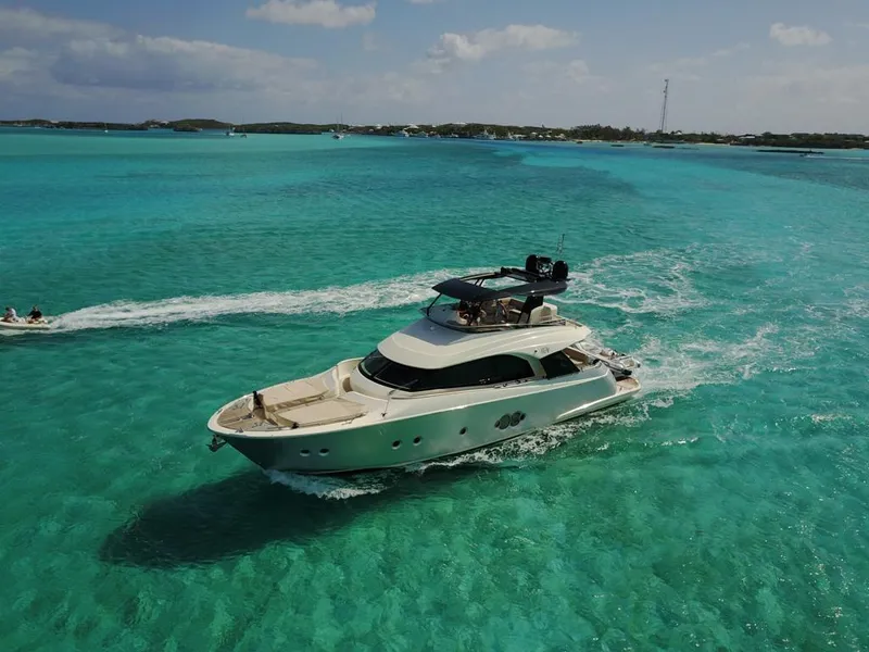 Slide: The Image of 2018 Monte Carlo Yachts MCY 65 cruising in clear turquoise waters. - 12