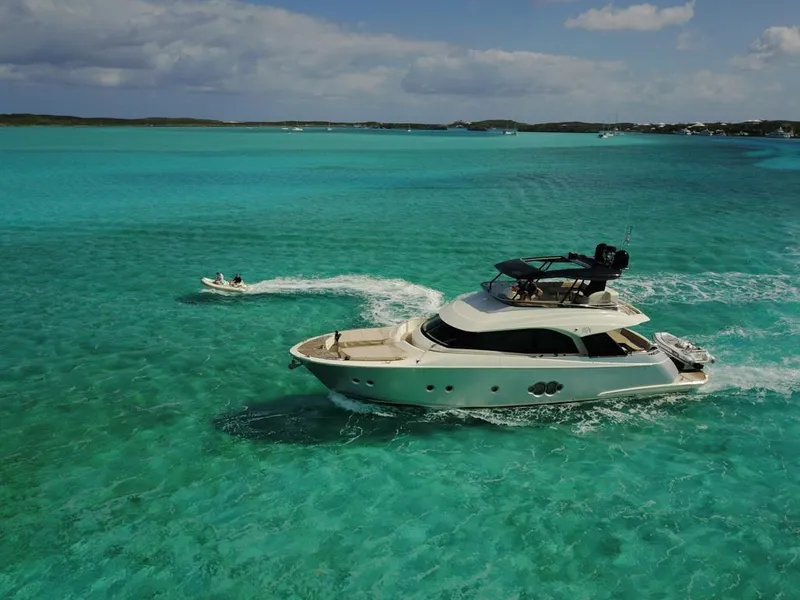 Slide: The Image of 2018 Monte Carlo Yachts MCY 65 cruising in turquoise waters. - 13