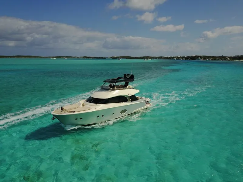 Slide: The Image of 2018 Monte Carlo Yachts MCY 65 cruising in clear turquoise waters. - 14