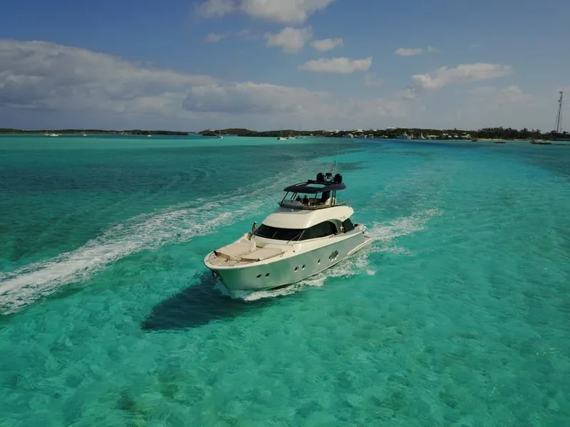 Slide: The Image of 2018 Monte Carlo Yachts MCY 65 cruising in clear turquoise waters. - 15