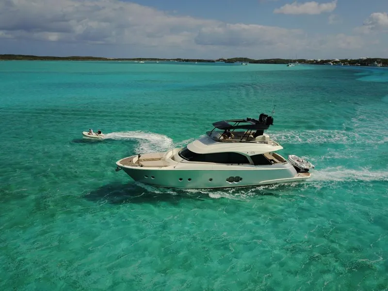 Slide: The Image of 2018 Monte Carlo Yachts MCY 65 cruising in clear turquoise waters. - 18