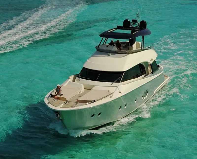 Slide: The Image of 2018 Monte Carlo Yachts MCY 65 cruising on turquoise waters. - 2